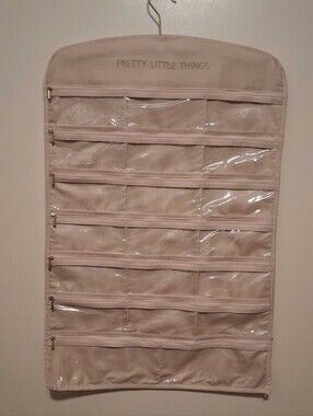 PrettyLittleThing Blush Beige Hanging Jewelry Organizer with Clear Zip Pockets